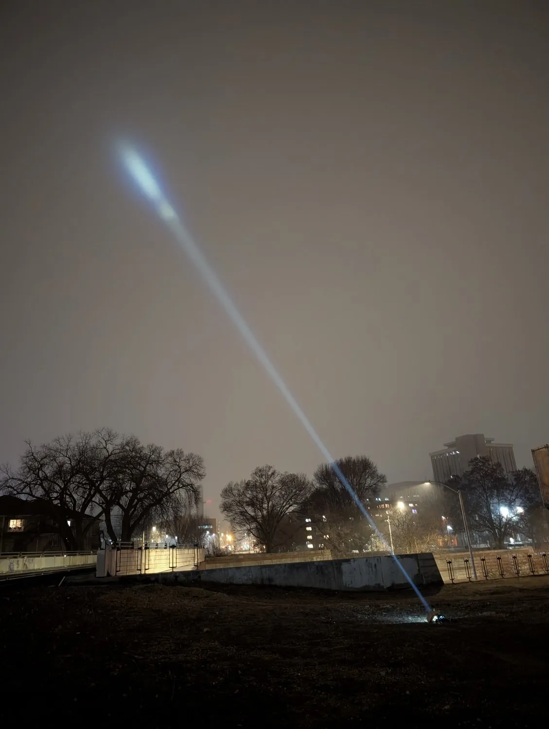 Beam into a hazy night sky
